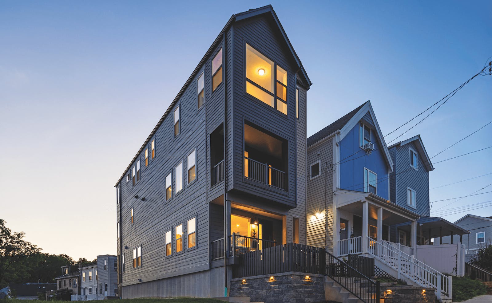 The Picket Fence Idea Home is a three-story detached townhouse consisting of a 2,007-square-foot unit above a 660-square-foot ADU.