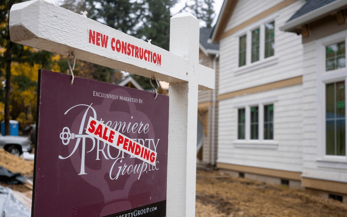 Newly built home for sale with sale pending sign out front