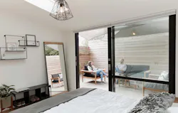 2019 Professional Builder Design Awards Gold Infill bedroom with access to outdoor patio 2019 Professional Builder Design Awards Gold Infill bedroom with access to outdoor patio