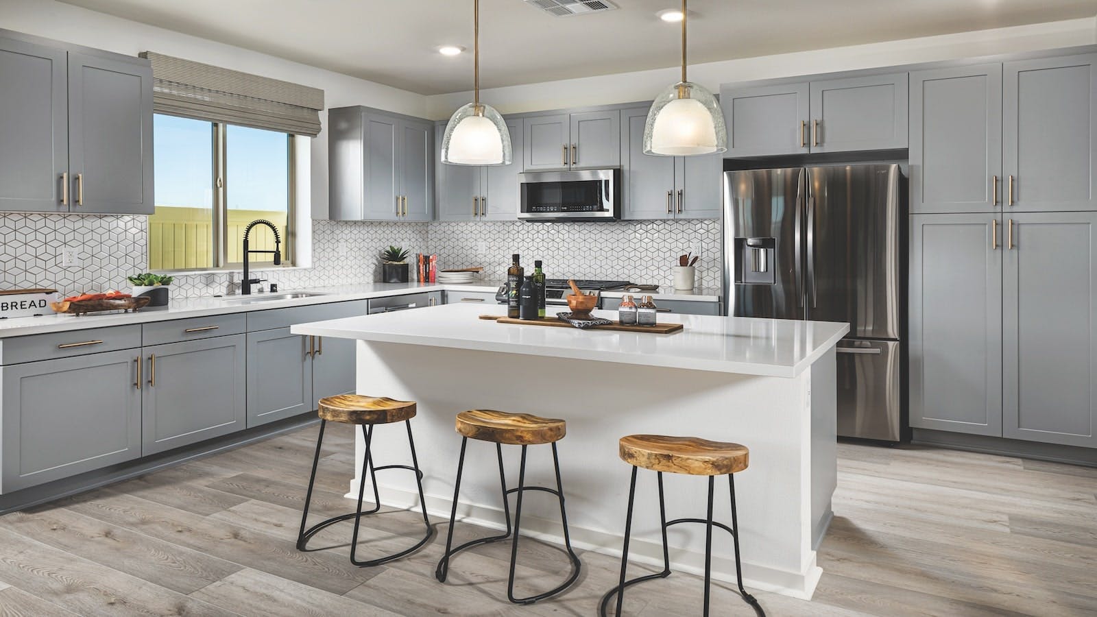 A kitchen with a generous island at Landsea Homes' Rohe at Neuhouse