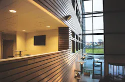 Thermory heat-treated ash siding applied on an interior Thermory heat-treated ash siding applied on an interior