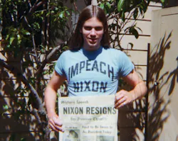 young man wearing Impeach Nixon T-shirt and holding SF Chronicle newspaper with Nixon headline young man wearing Impeach Nixon T-shirt and holding SF Chronicle newspaper with Nixon headline