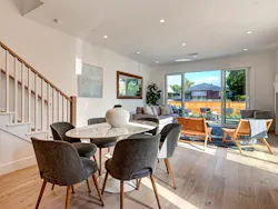 Living space in a Trademark by TJH connecting to the outdoor living area Living space in a Trademark by TJH connecting to the outdoor living area