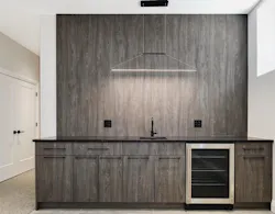 Clever lighting in the kitchen looks like a range hood but is not Clever lighting in the kitchen looks like a range hood but is not