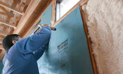 Installing insulation in The New American Home 2023, a high-performance, energy-efficient home Installing insulation in The New American Home 2023, a high-performance, energy-efficient home