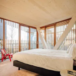 Freebooter Biophilic Apartment Building GG loop Amsterdam Netherlands Bedroom Timber Red Eames Freebooter Biophilic Apartment Building GG loop Amsterdam Netherlands Bedroom Timber Red Eames