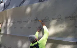 SYMBI’s siding installers tack the Slicker MAX rainscreen to the FlatWrap SYMBI’s siding installers tack the Slicker MAX rainscreen to the FlatWrap