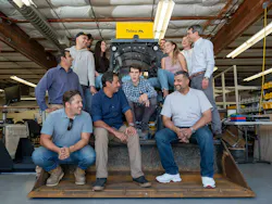 Teleo company employees playful on construction equipment Teleo company employees playful on construction equipment