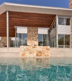 Petersen Aluminum Carson Design Associates Texas Hill Country Modern House View across the pool Petersen Aluminum Carson Design Associates Texas Hill Country Modern House View across the pool