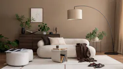 An organic modern living room, with warm brown walls, wooden dresser, large floor lamp, and white couch An organic modern living room, with warm brown walls, wooden dresser, large floor lamp, and white couch