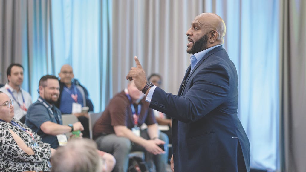 Speaker talking to a group of attendees at the International Builders' Show Centrals