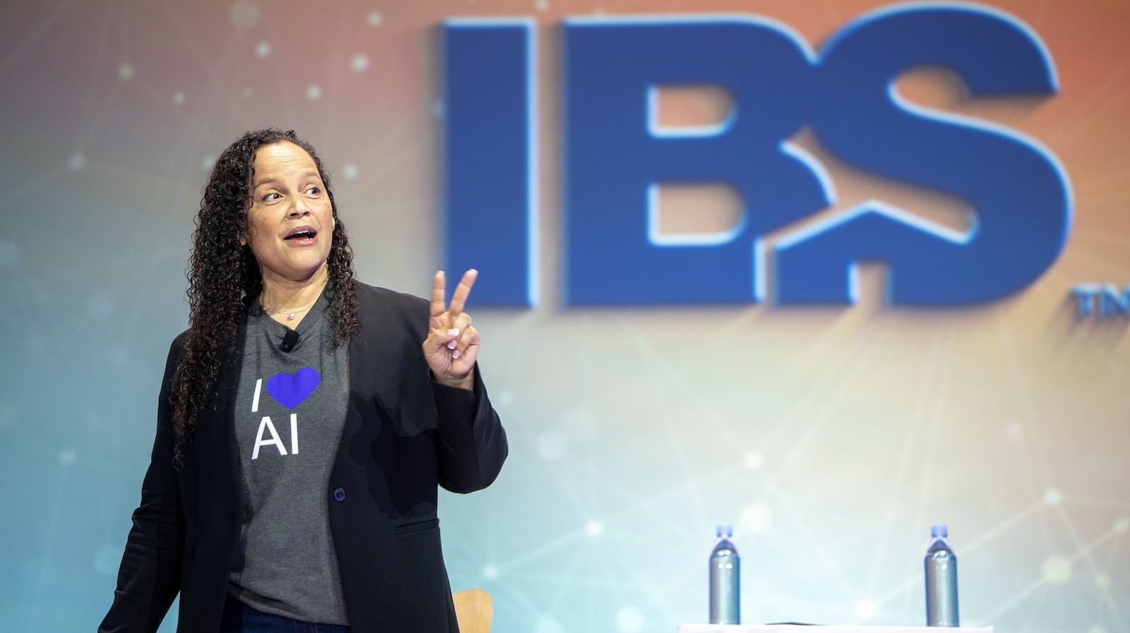 IBS Education session presenter on stage giving a presentation to home builders.