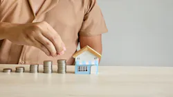Coins are stacked in ascending order. A model home next to the coins indicates an increase in housing costs. Coins are stacked in ascending order. A model home next to the coins indicates an increase in housing costs.