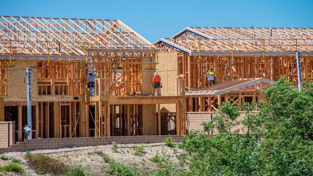 Builders work on new rental housing development