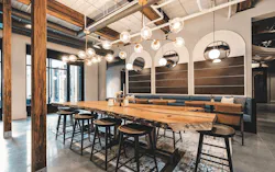 Interior at Chronicle Mill, with bar seating and a dining area Interior at Chronicle Mill, with bar seating and a dining area