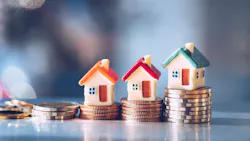 Model homes with stacks of coins underneath them indicate rising housing costs and limited housing affordability. Model homes with stacks of coins underneath them indicate rising housing costs and limited housing affordability.