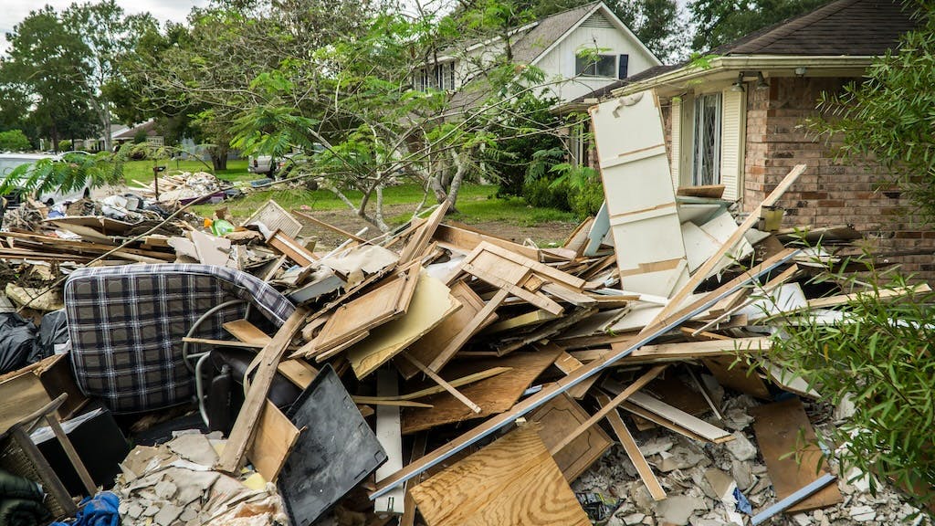 A home that lacks homeowners insurance sits damaged in the aftermath of a hurricane.
