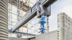 A large 3-D printer printing the walls of a home A large 3-D printer printing the walls of a home