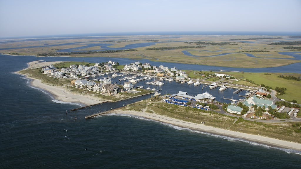 Aerial view of coastal homes in North Carolina, a location prone to extreme weather events and sea-level rise.