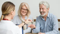 Baby Boomer couple buying new home in hot housing market Baby Boomer couple buying new home in hot housing market