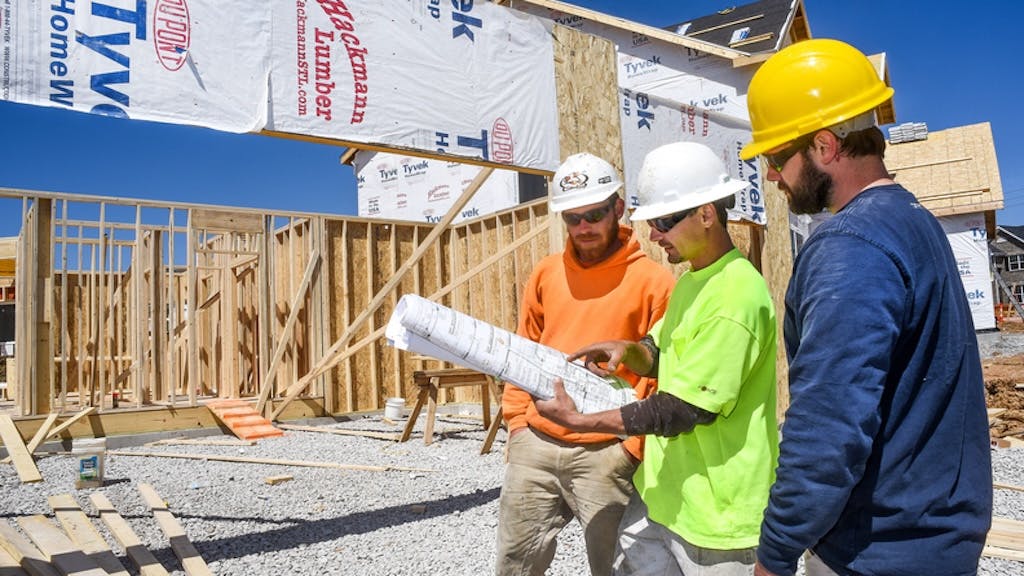 Builders working together at a construction site