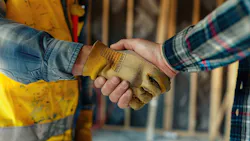 Two home builders shake hands Two home builders shake hands