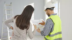 Home builder shows design concepts to client Home builder shows design concepts to client