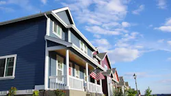 Row of small, newly-constructed single-family homes Row of small, newly-constructed single-family homes