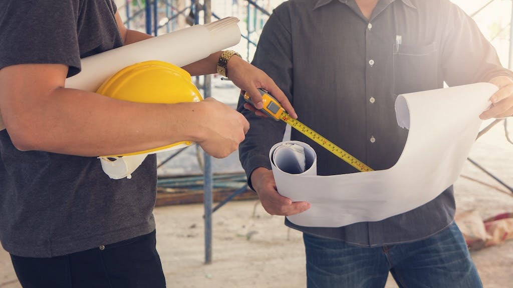 Home builders working together on a project