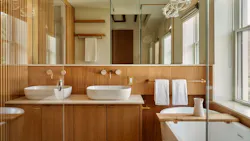 Bathroom showcasing flat-panel cabinets and wall-mounted faucets Bathroom showcasing flat-panel cabinets and wall-mounted faucets