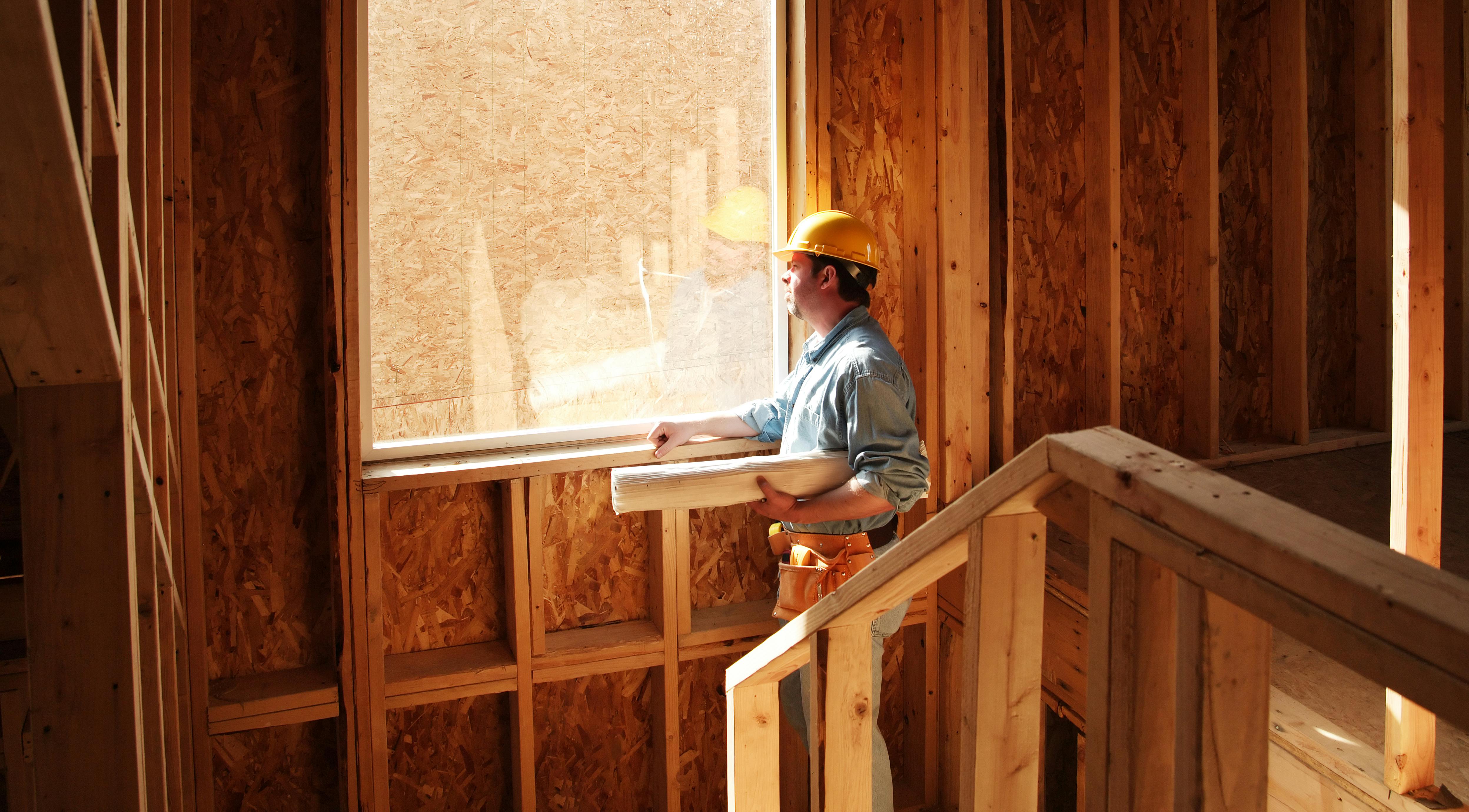 Construction worker looking to the future