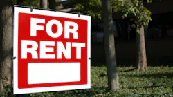 'For Rent' sign posted in a front yard 'For Rent' sign posted in a front yard
