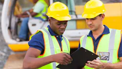 Construction workers working collaboratively Construction workers working collaboratively