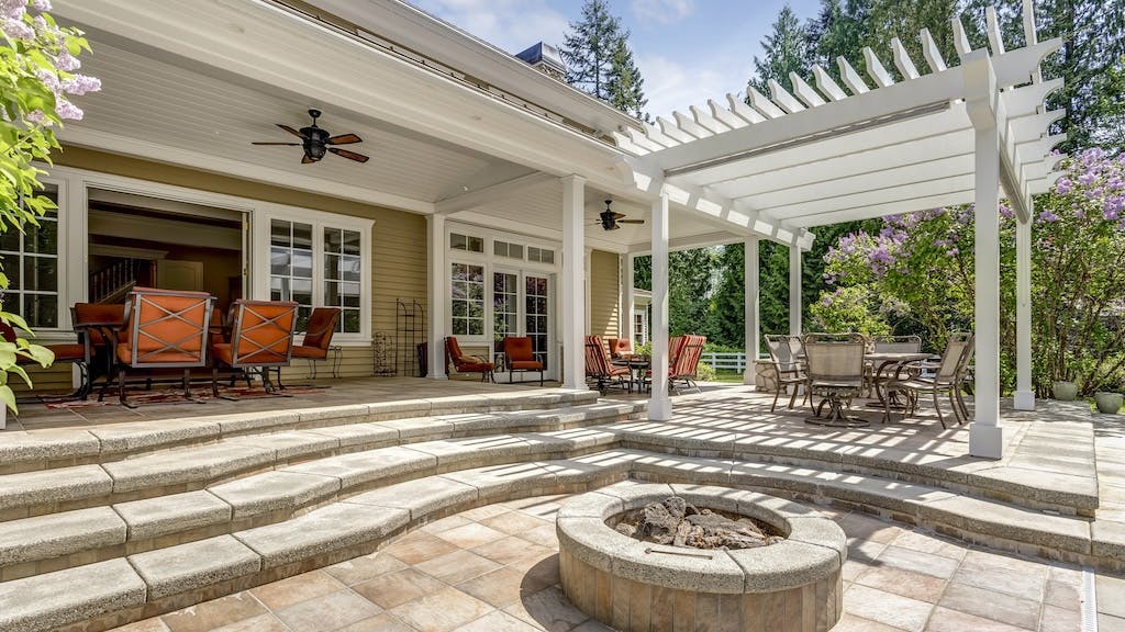 Cozy outdoor space featuring outdoor fireplace