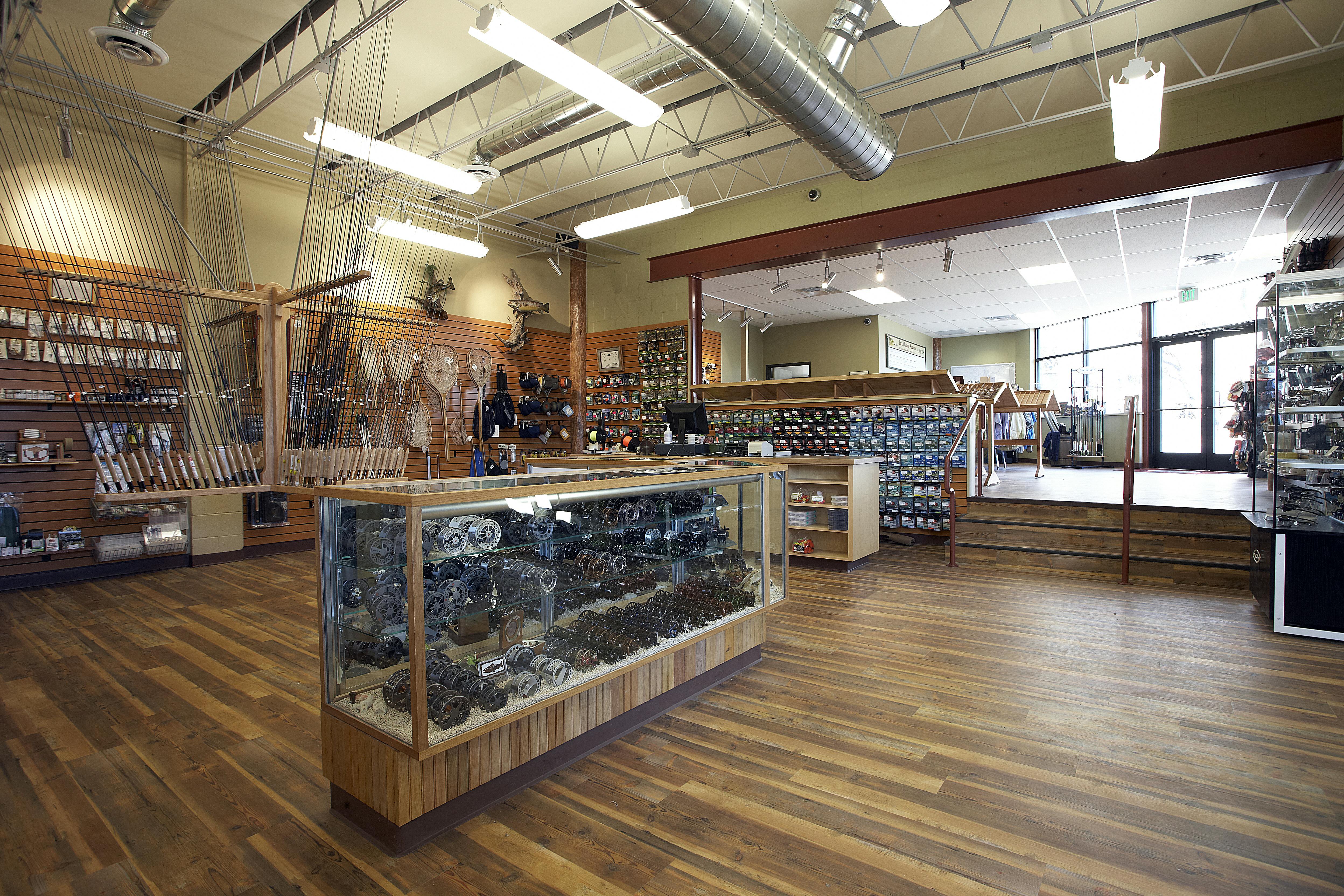 A new steel beam installed in the existing CMU wall between sales areas provided