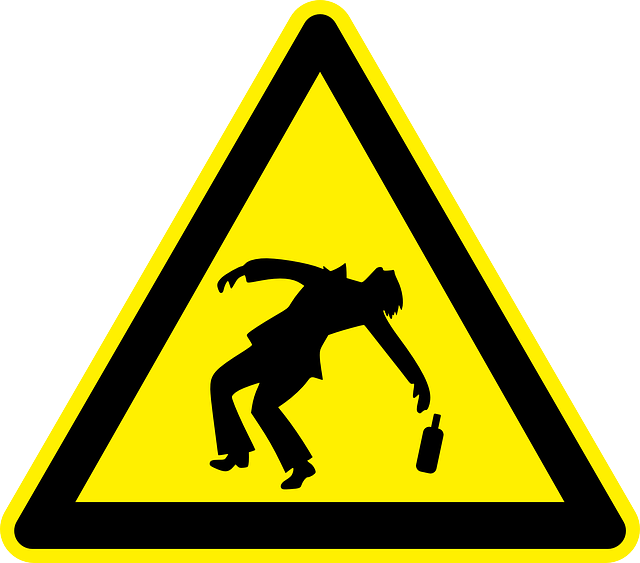 Caution sign with drunk person