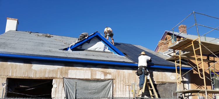 contractors on roof for a roofing job roofing inspection