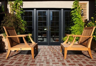 M.R.S. used black exterior frames on the new Andersen windows to match the facad