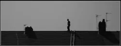 Man walking on roof Man walking on roof