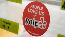 Yelp sticker on business door. Yelp sticker on business door.