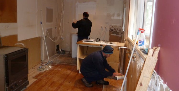 subcontractors&mdash;plumber and electrician&mdash;at work