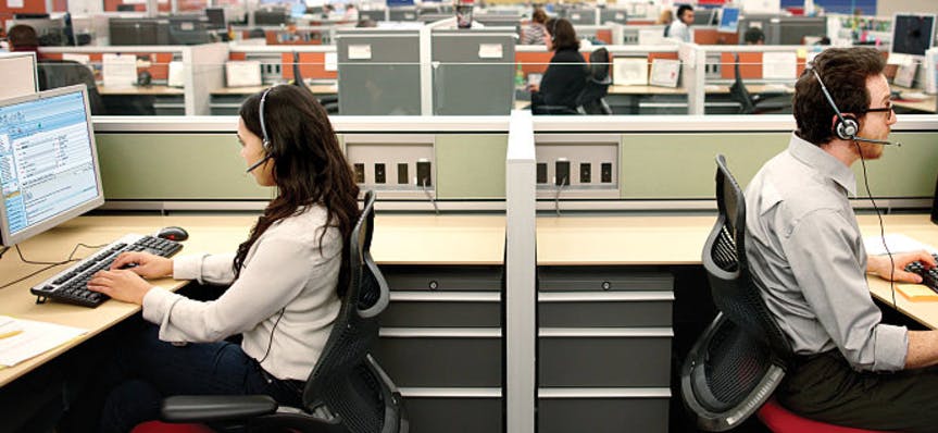 Call center workers at desks