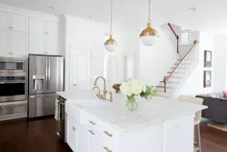 white kitchen with island, pendant lights, and cabinetry white kitchen with island, pendant lights, and cabinetry