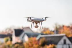 Drone flying in front of home Drone flying in front of home