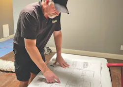 project construction manager reviewing plans project construction manager reviewing plans