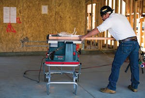 The Reaxx portable table saw in use.