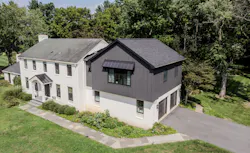 Cornerstone Remodeling added a large primary suite over their client's existing garage. The big challenge was designing the exterior so it kept the original home's charm and curb appeal. Photo: Cornerstone Remodeling. Cornerstone Remodeling added a large primary suite over their client's existing garage. The big challenge was designing the exterior so it kept the original home's charm and curb appeal. Photo: Cornerstone Remodeling.