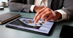 person working with design program on tablet person working with design program on tablet