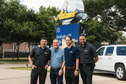 Perry Adams and son, Joe, with members of the shop team. Perry Adams and son, Joe, with members of the shop team.