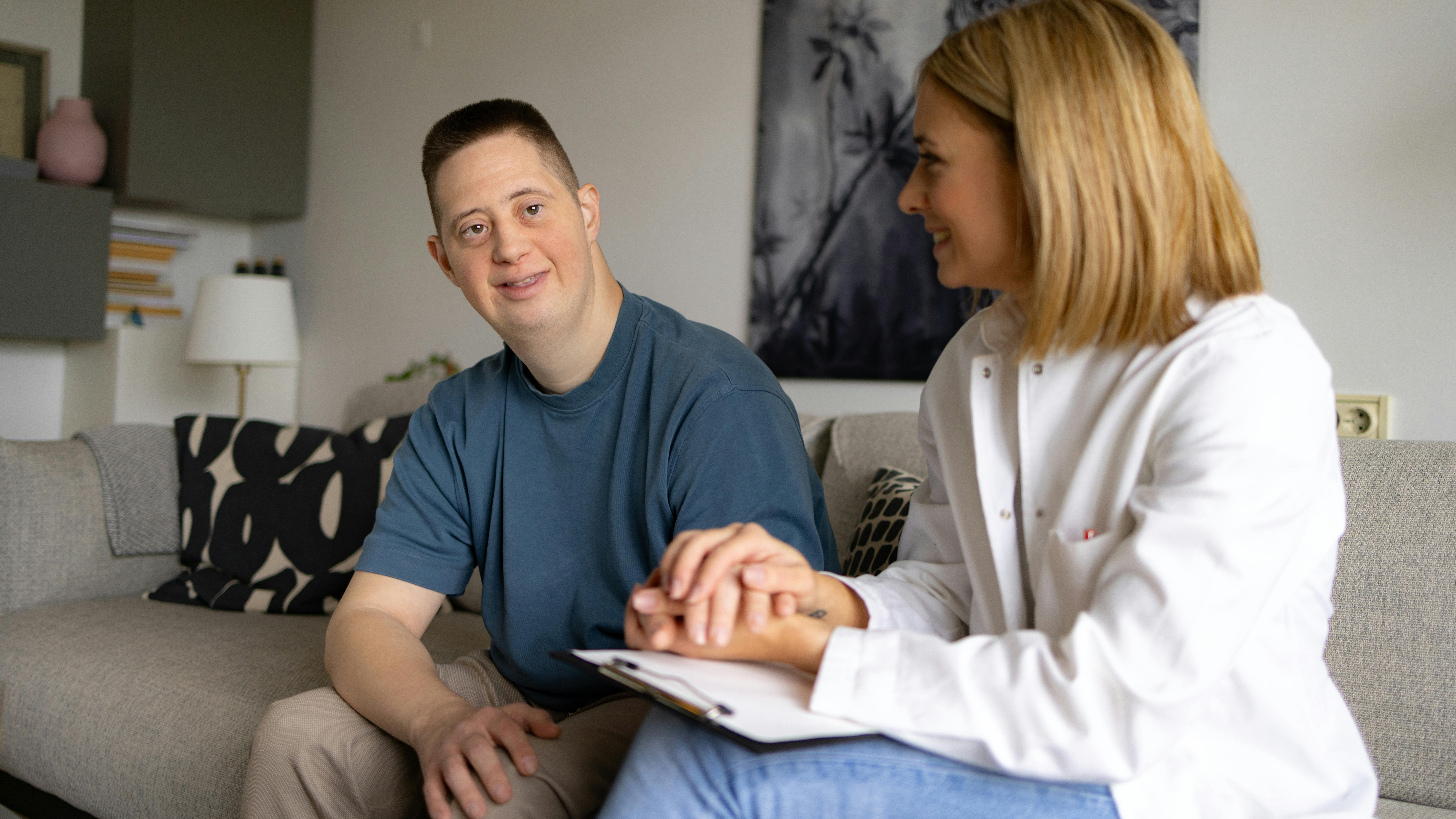 A dental hygienist with a special needs patient